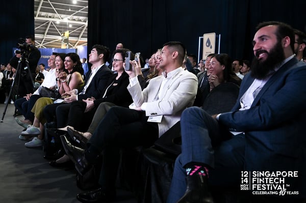 Delegates in the audience reacting to a session