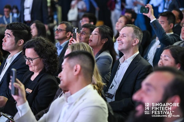 Delegates in the audience listening to a session