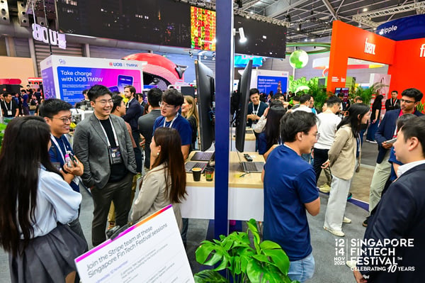 Delegates in conversation at an exhibition stand