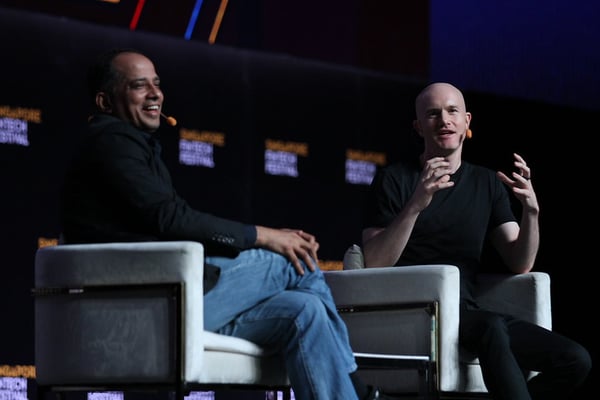 Two speakers in conversation on stage