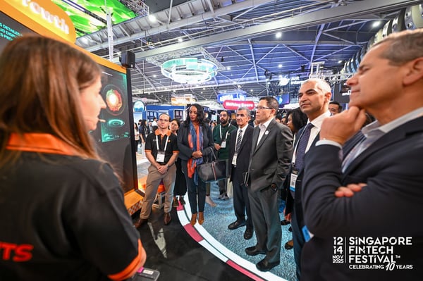 A delegation in suits touring the exhibition floor