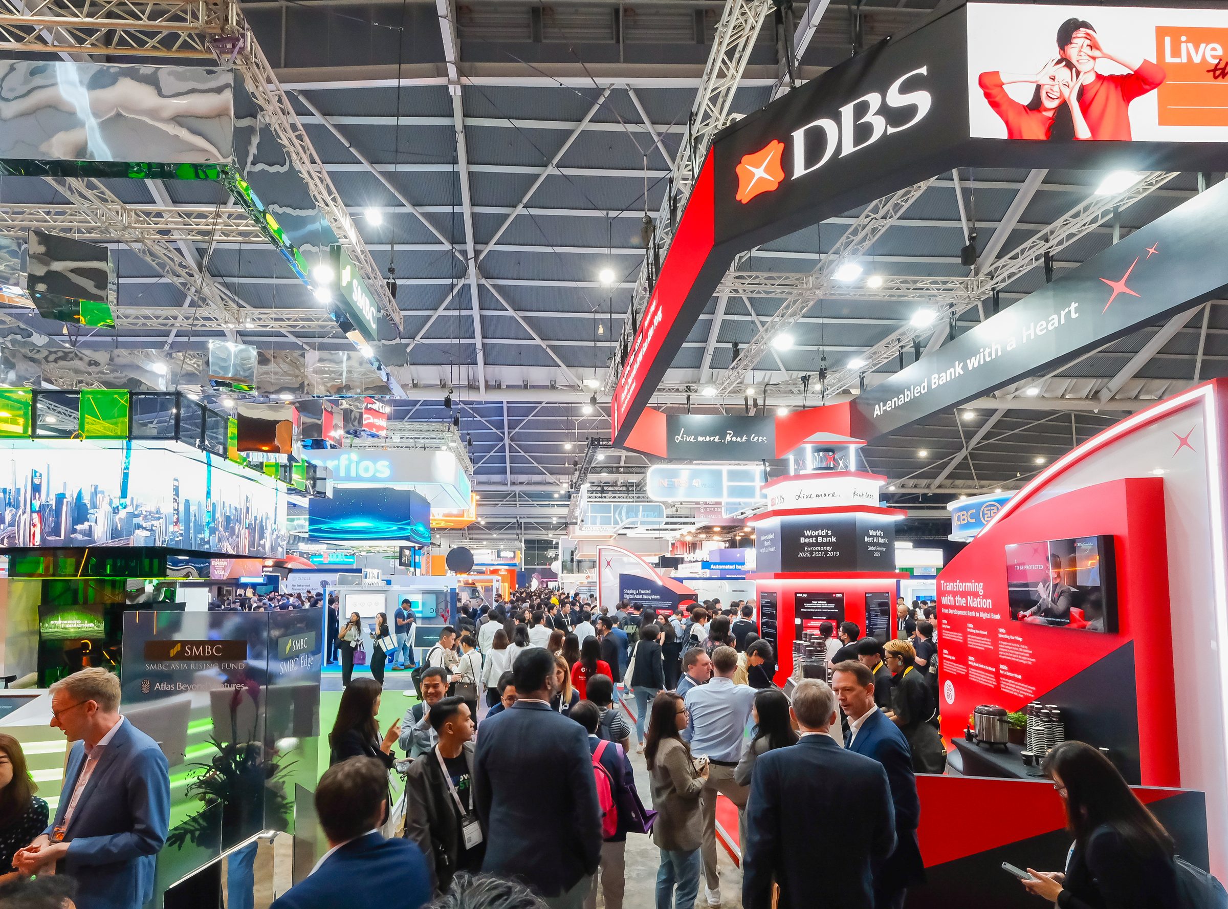 Crowds in the exhibition aisle between the DBS and SMBC stands at Singapore EXPO