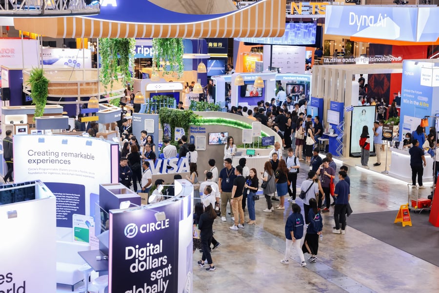 Visitors walking between the stands in the SFF exhibition hall